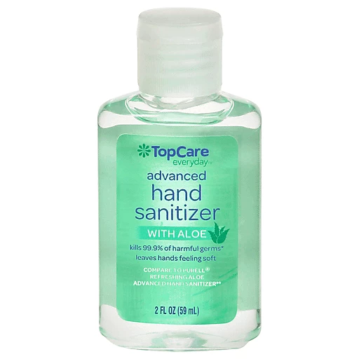 Alcohol Gel Hand Sanitizer In Kitchen With Garlic And Onion On